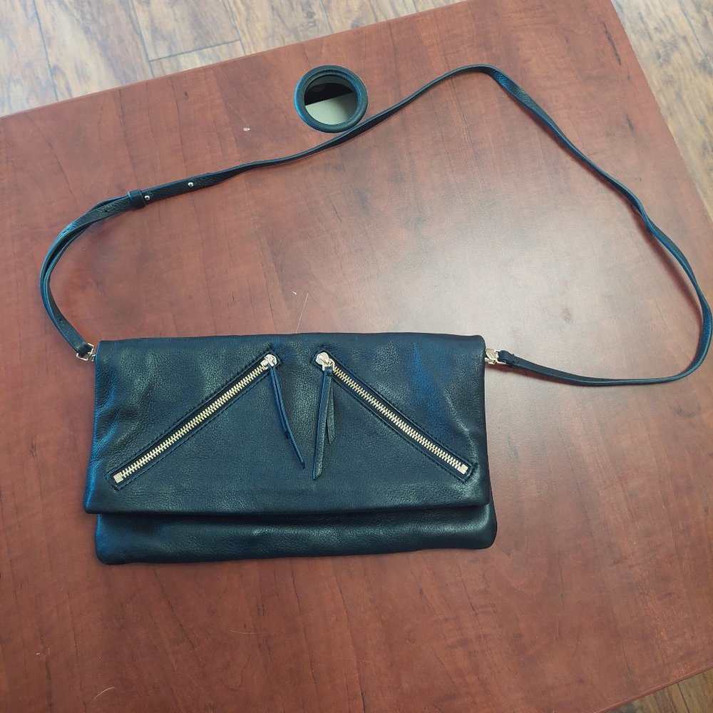 Covet clutch bag with shoulder strap